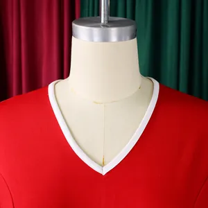 Close-up detail of V-neckline with white contrast trim on a professional red dress