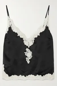 Detail of black satin camisole top with delicate white floral lace trim for women
