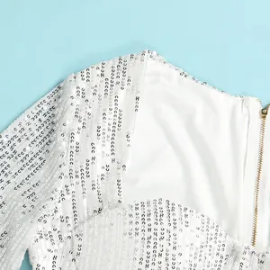 Close-up detail of a white sequined nightclub dress with high-quality gold-tone zipper
