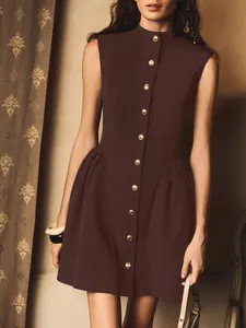 Detail view of a brown French vintage sleeveless dress with elegant gold buttons.