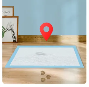 Close-up detail of a thickened absorbent pet pee pad for dogs on a wooden floor