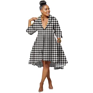 Elegant black and white houndstooth dress with a deep V-neck and fashionable lapel