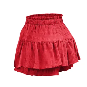 Mini gonna-pantalone rossa a balze con vita alta a punto smock per moda estiva donna