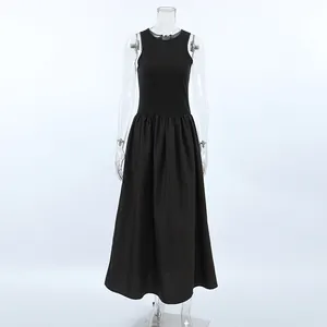 Detail view of a vintage Hepburn style black knit sleeveless maxi dress for spring wear
