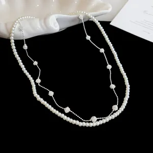 Detail view of a French retro double-layered necklace with pearls and silver beads