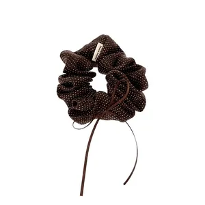 Vintage dark brown polka dot scrunchie with delicate bow and handmade label detail