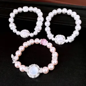 Elegantes pulseras elásticas de perlas y circonitas con diseño de lujo francés