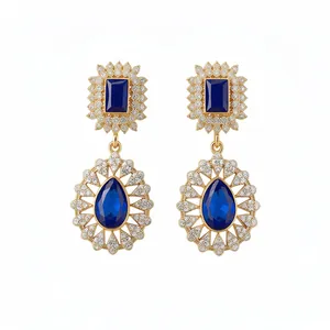 Vintage gold palace style earrings with blue teardrop crystals and zircons