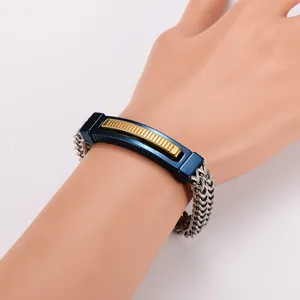Close-up of hip-hop stainless steel bracelet with blue curved plate and gold ridges.