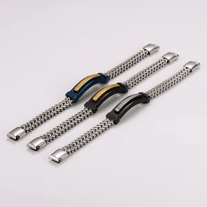 Detailed view of three stainless steel hip hop bracelets in blue, black, and gold