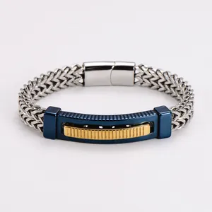 Detail view of hip hop stainless steel bracelet with blue curved plate and gold accent