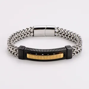 Detail showing the intricate wheat chain and black-gold curved plate of this steel bracelet.