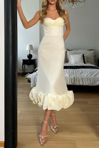 Elegant ivory sweetheart neck midi dress with voluminous ruffled hem and slim fit
