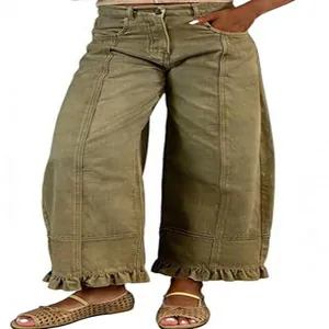 Close-up detail of retro Y2K style olive green wide-leg denim pants with ruffled hems