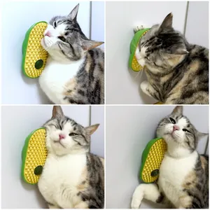 Detailed close-up showing a cat enjoying the avocado-shaped self-groomer toy