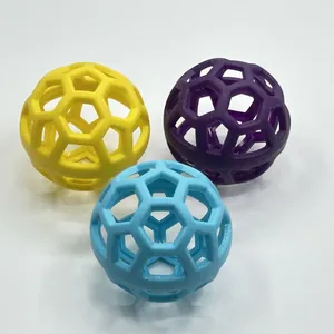 Set of three colorful durable TPR hollow pet toy balls with hexagonal pattern for dogs.