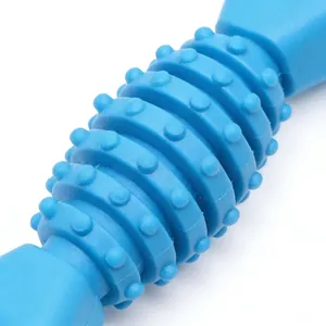 Detail macro view of blue TPR fishbone dog chew toy with dental cleaning nubs