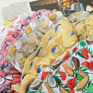 Vibrant fruit print pet princess dresses with ruffled layers for small dogs and cats