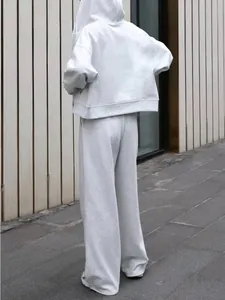 Rear view of a premium grey oversized zip-up hoodie and wide-leg sweatpants set in cotton