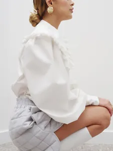 Elegant French style white ruffled collar blouse with long sleeves and loose fit for women.