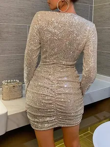 Gold sequin long sleeve mini dress with ruched detailing for evening party