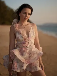 Elegant floral print V-neck mini dress with ruffled skirt for summer beach vacations.
