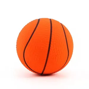 Detailed macro view of an orange squeaky basketball dog toy with realistic textured surface