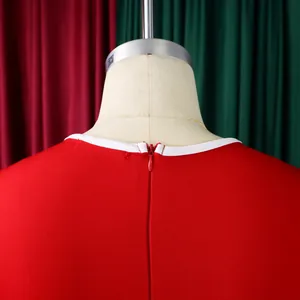 Detailed view of the back invisible zipper and white piping on a red elegant pencil dress.