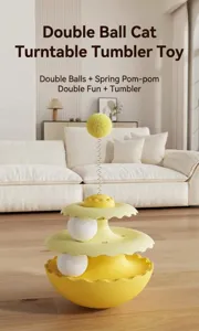 Detail view of cat tumbler toy with spring pom-pom and turntable balls.