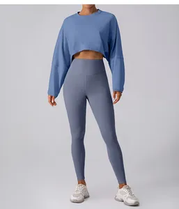 Front view of blue crop top long sleeve sweatshirt and matching yoga leggings set