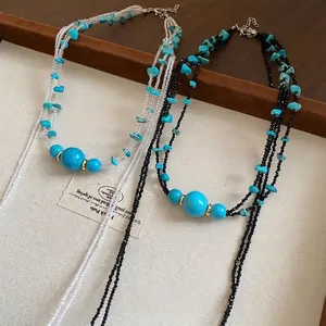 Handmade multi-layered necklace with turquoise stone beads and black crystal strands