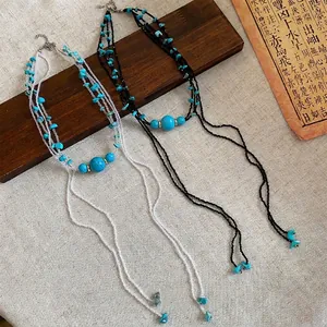 Bohemian style multi-layer beaded necklace with turquoise stones and tassel fringe