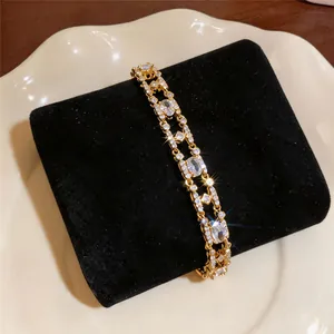 Detailed macro shot of 18k gold plated bracelet with sparkling oval zircons