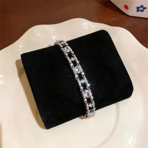 Close-up detail of 18k gold plated bracelet featuring sparkling oval cubic zirconia stones