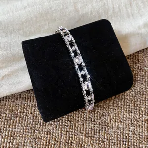 Close-up detail of 18k gold plated zircon oval bracelet with brilliant sparkle finish