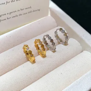 Elegant 18k gold plated honeycomb hoop earrings inlaid with sparkling zirconia stones.