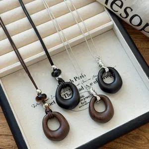 Vintage style acrylic oval pendant necklace set with leather cord and silver chain