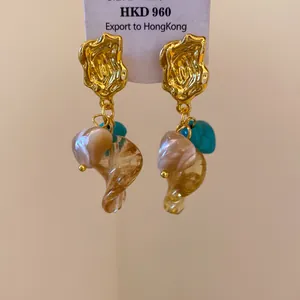 Detailed view of vintage Maillard style earrings with mixed stone and glass charms