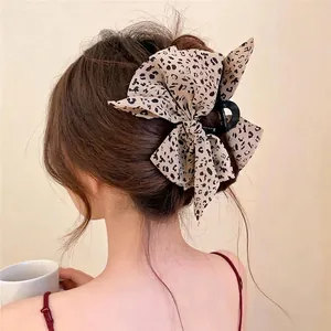 Pinza de pelo vintage con lazo de leopardo para peinados elegantes y sofisticados