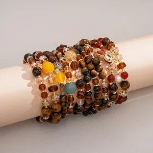 Elegant retro tiger eye and glass beaded bracelets displayed on a jewelry stand