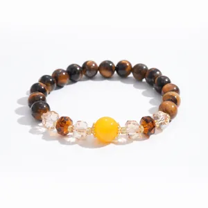 Elegant vintage tiger eye stone and glass beaded bracelet with a striking yellow centerpiece