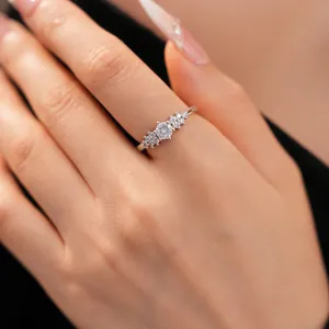 Close-up detail of an elegant silver zircon ring featuring a clustered stone design