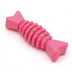 Detailed macro view of durable pink TPR dog chew toy with textured teeth cleaning nubs