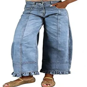 Vintage washed wide-leg denim pants featuring ruffled hems and relaxed Y2K fit detail.