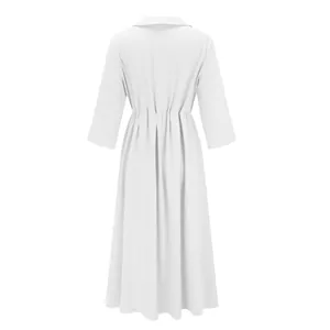 Back view of white cotton linen dress showing the gathered waist and flared skirt