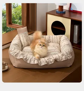 Floral pet sofa bed featuring ruffles and a matching pillow in a cozy home setting