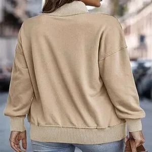 Back view of a beige women's mock neck casual sweatshirt with ribbed cuffs and hem