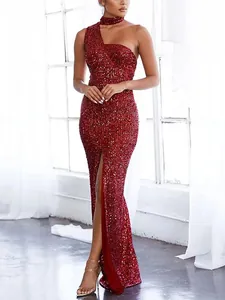 Close-up of elegant wine red sequin one-shoulder gown with high slit and slim fit