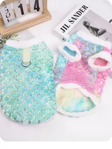 Macro view showing the glittering mermaid scale texture and soft fleece trim on pet clothing