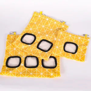 Set of yellow geometric hanging hay feeder bags for rabbits and guinea pigs in three sizes